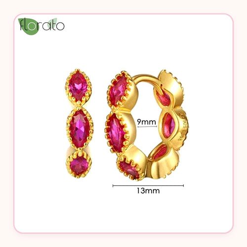 Small gold huggie earrings lined with pink marquise stones