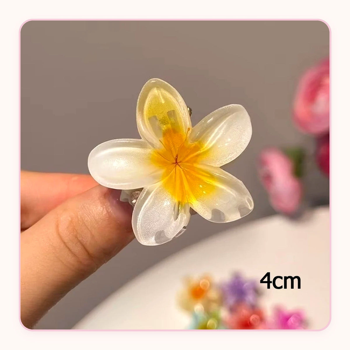 Six translucent plumeria flower claw clips in pastel colors