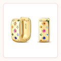 Chunky gold huggie earrings with rainbow star-shaped stones