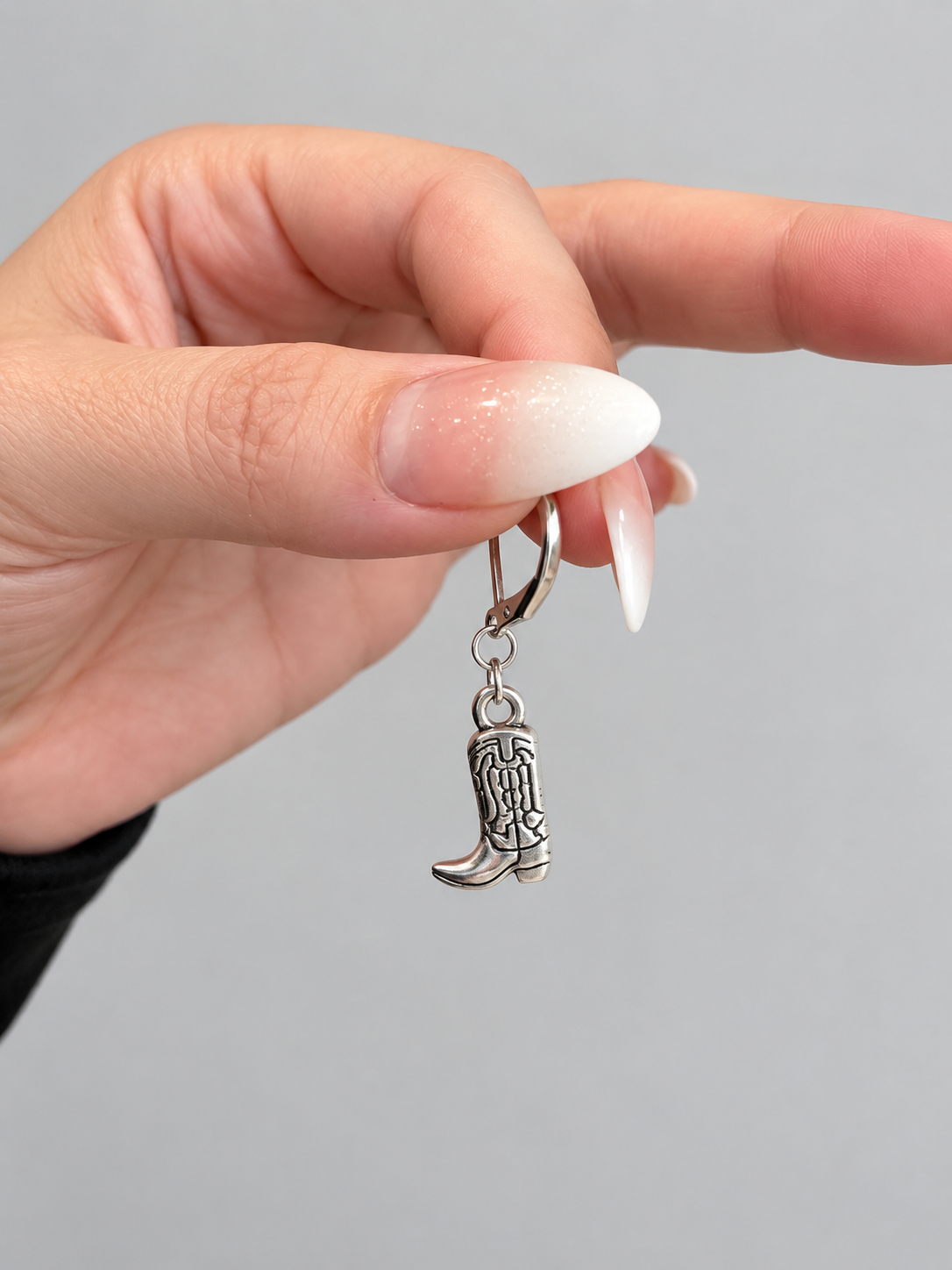 Silver cowboy boot charm earring on lever-back hook